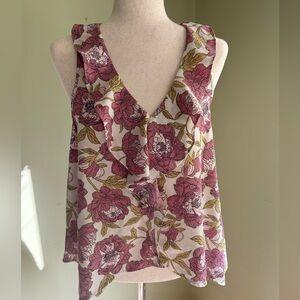 Leith Size M floral sleeveless top. V neck w/ruffle  Asymmetrical hem Lovely!